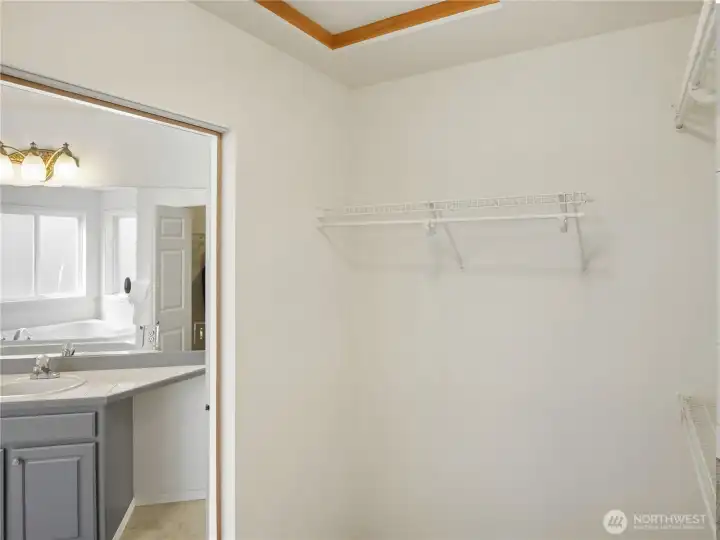 An ensuite walk-in closet that makes selecting your daily wardrobe a breeze.