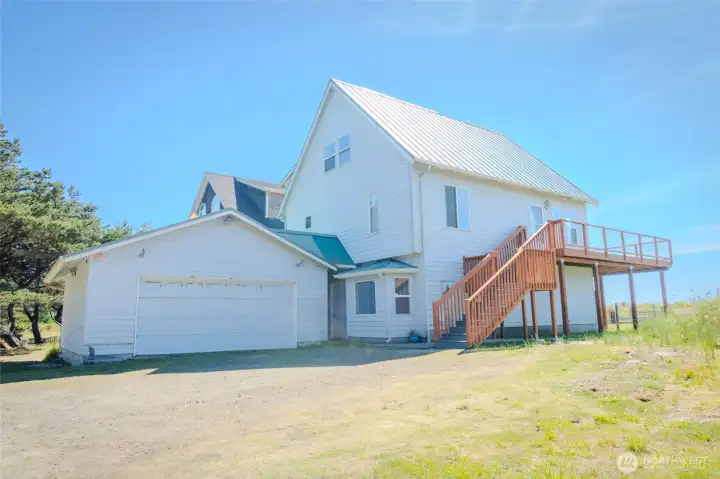 Welcome to your ocean front home! Over a half an acre with 3 bay shop!