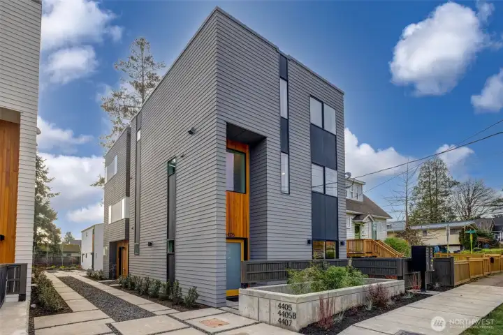 Striking modern façade featuring warm cedar accents & bold architectural lines—an eye-catching first impression in a quiet, convenient Brighton location. Striking modern façade featuring warm cedar accents & bold architectural lines—an eye-catching first impression in a quiet, convenient Brighton location.