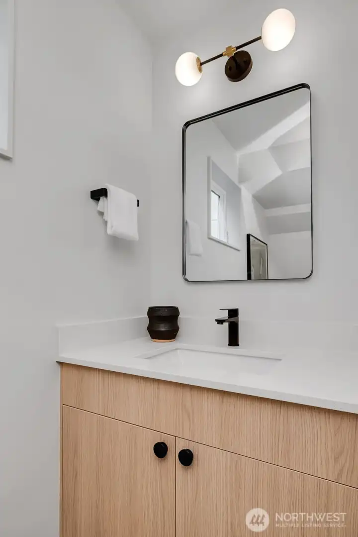 Stylish main-floor powder room—perfect for guests. Stylish main-floor powder room—perfect for guests.