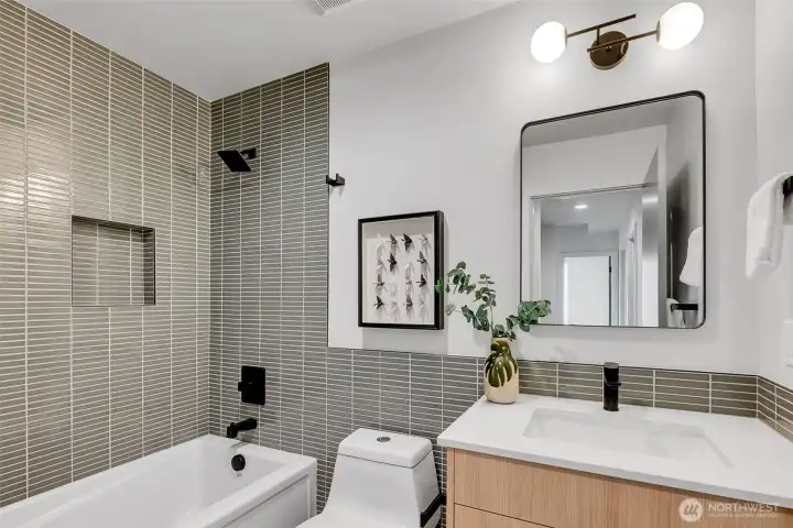 Beautifully tiled full bathroom with deep soaking tub is shared with 2 bedrooms on the second level. Beautifully tiled full bathroom with deep soaking tub is shared with 2 bedrooms on the second level.