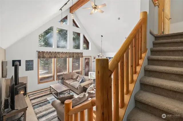 Beautiful log railing leading to private upper level.