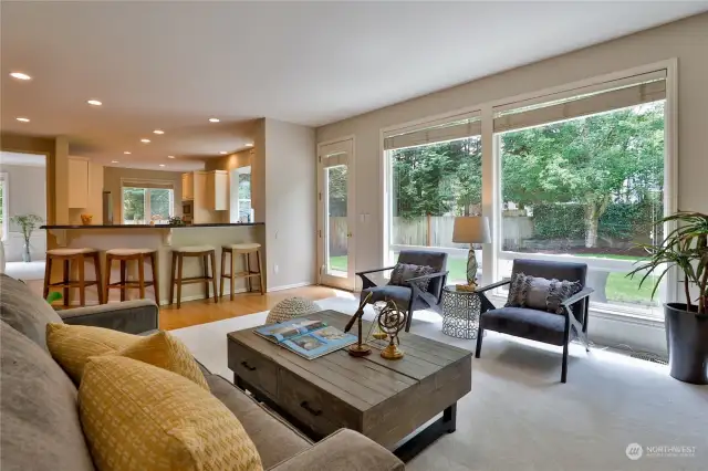 Family Room with access to (and view of) Back Patio/Yard, connects to Kitchen via breakfast bar!