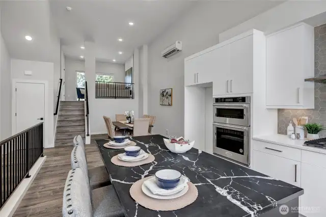 Kitchen features island with eating space (photos of lot34, same floorplan)