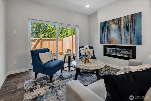 Bright living room connected to backyard (photos of lot34, same floorplan)