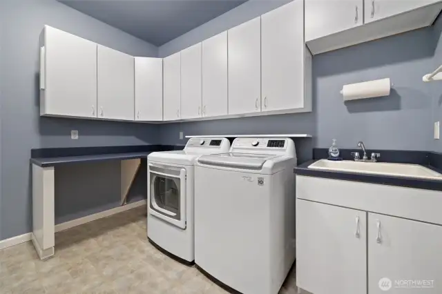 Massive laundry room with washer and dryer