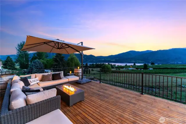 Exterior twilight view of Lake Chelan from the spacious upper level deck.