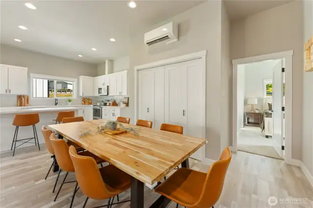 View 3 of the dining room designed to comfortably sit 8 guests looking towards the large pantry & upper level guest bedroom.