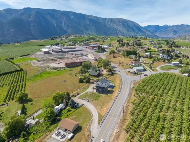 Aerial view of property w/ surrounding orchards.