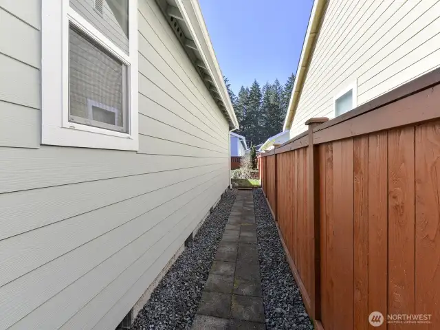 Side of home has gravel and easy maintenance.