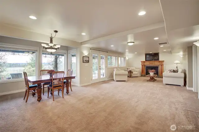 Basement dining area off kitchen has plenty of space for a large dining table