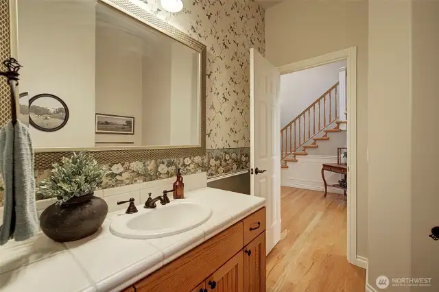 Main level bathroom with separate shower room