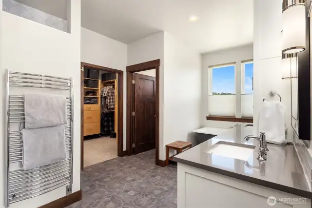 Soaking tub with views, large walk-in closet with built-ins