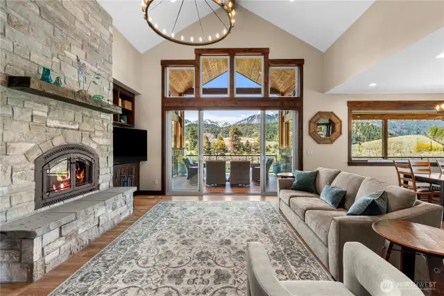 Abundant Natural Light, Large living with natural stone wood burning fireplace