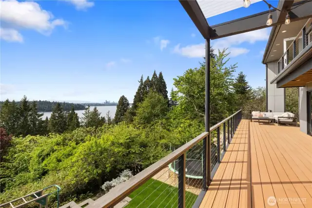Situated far away from the street, this home features an expansive west-facing deck ideal for entertaining or relaxing in a peaceful, private setting.