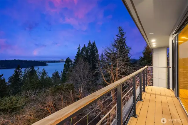 The private balcony off the primary bedroom offers a “top of the world” feeling with elevated, awe-inspiring views whether at day or night.