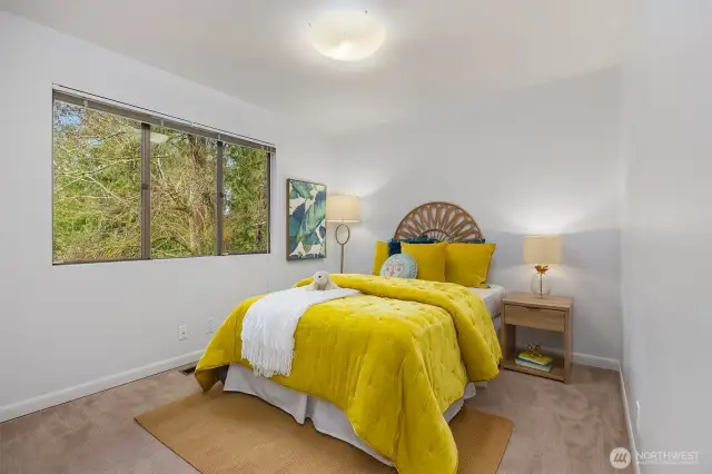 Bedroom one of three on the same floor offers serene views and privacy.