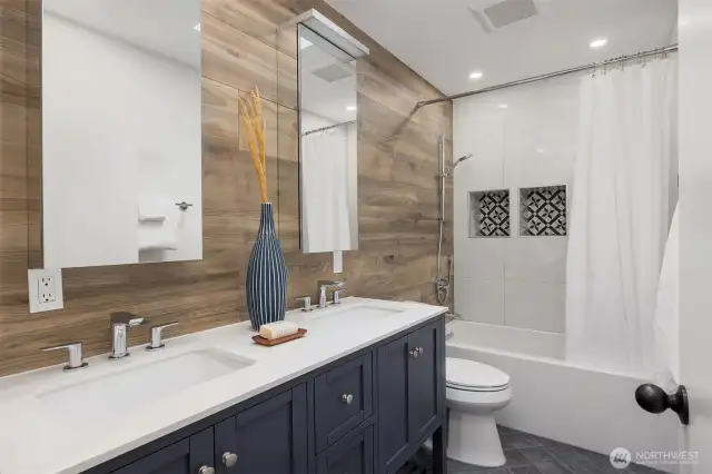 A full size bathroom with updated finishes and storage space is conveniently located near all three bedrooms (including the en-suite that has its own bathroom).