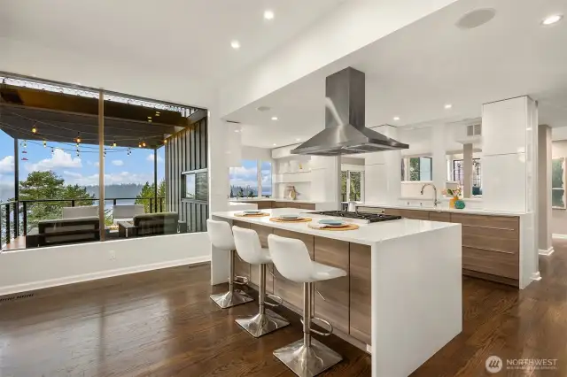 Spacious kitchen featuring sleek modern cabinetry, two dishwashers, two sinks, and every amenity for effortless entertaining and everyday living.