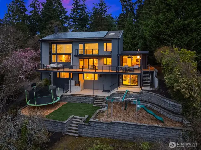 Perched far back from the street, this home is an entertainer's dream plus an incredibly private oasis. Take in stunning sunsets and watch the activity on the lake from the expansive private deck.