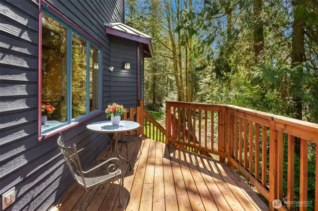 Main floor deck with wooded views