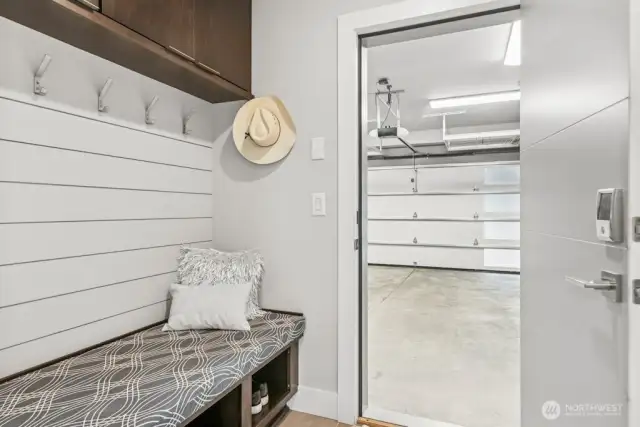 perfect catch all spot at the garage entry - bench, coat rack, shoe shelves and storage