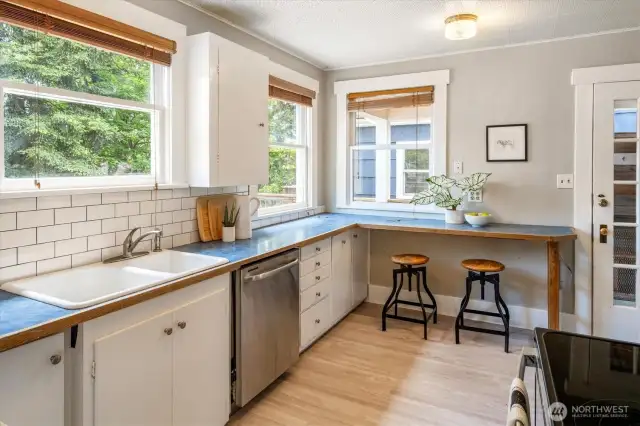 Another view of the light-filled kitchen with door to the backyard deck.