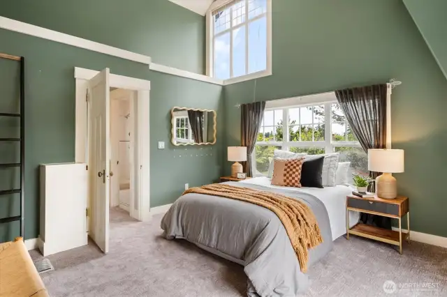 The largest of the three upstairs bedrooms features new carpet, vaulted ceilings and great natural light.