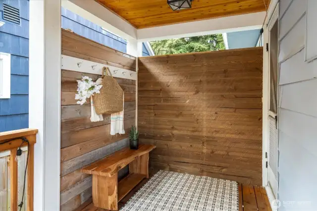 Covered back porch leading into the kitchen.