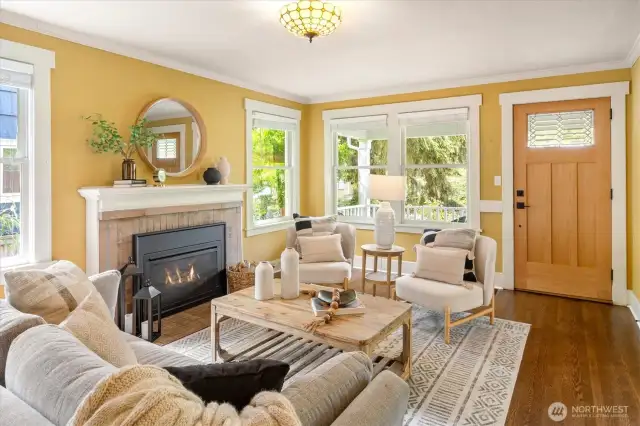 The living room features refinished hardwood floors, gas fireplace and tons of natural light.