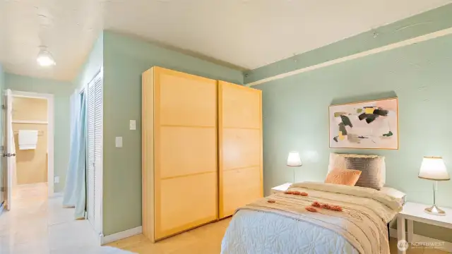 Like all two-bedroom condos at National Avenue, one bedroom is open to the stairwell. It gives off that cool "basement loft" vibe - open, flexible, and full of possibilities!