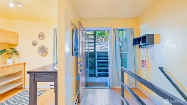 Only seven steps from your designated parking spot and you're at the front door! This home has been lovingly renovated from top to bottom - check out that eye-catching black metal railing for a pop of modern style.