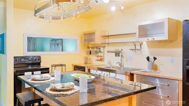 Wow! Renovations opened up the entire space by removing walls and adding this stunning kitchen island. Say goodbye to a closed-off kitchen and hello to effortless flow and functionality.