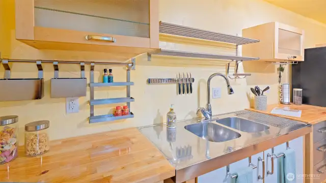 These brand-new butcher block counters are a total knockout! Warm, stylish, and ready to wow. And that high-arch faucet? Chef’s kiss.