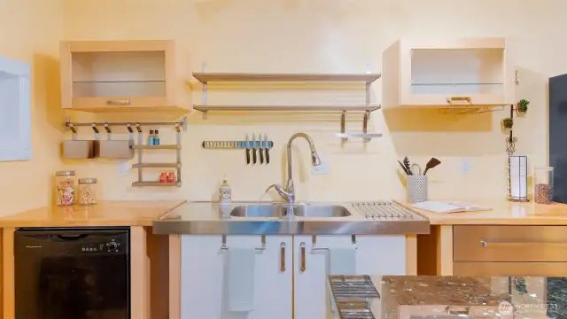 Display shelving and sleek stainless steel organizers turn this kitchen into a feast for the eyes - and a dream for anyone who loves to cook.