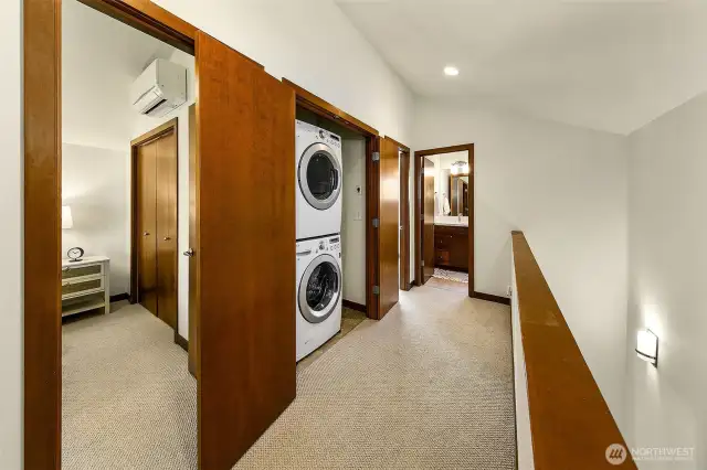 Wide hallway with convenient laundry closet on the upper level