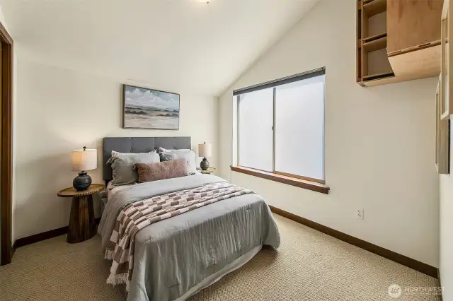 Second bedroom on the upper level (storage shelves convey)