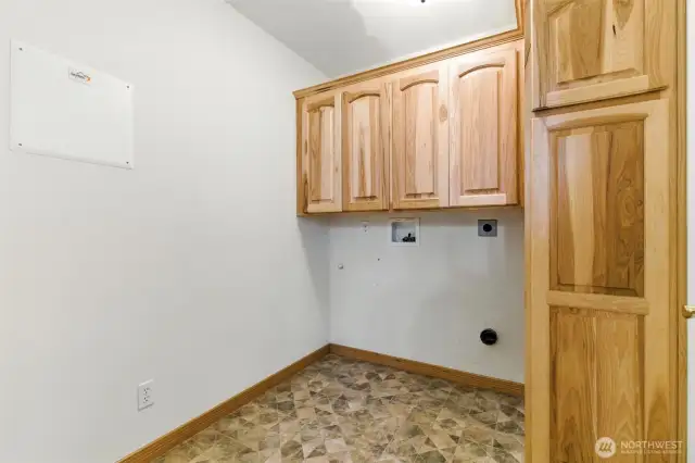 A dedicated utility room, thoughtfully designed to keep laundry and household tasks tucked away from the main living spaces.