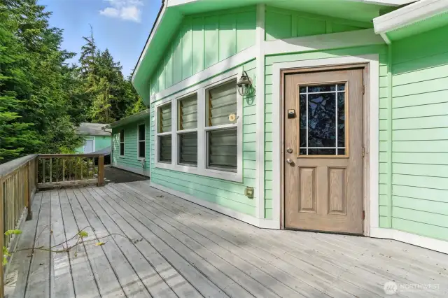 Enjoy the beauty of drought-resistant landscaping from the comfort of your private deck, offering a low-maintenance and serene outdoor retreat.