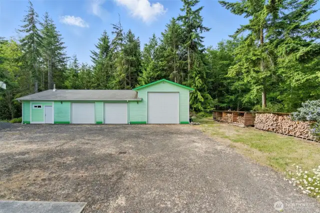 The impressive 2,017 sq ft detached shop features four bays, including one with a 12-foot door for RV parking, and a recreation room with heat and a ¾ bathroom. This versatile building offers abundant room for storage, projects, and recreational vehicles—all just steps from the main home.