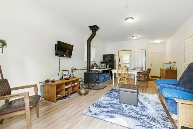 A large, versatile flex space in the detached garage offers endless possibilities—ideal for a home office, gym or studio. Wood stove and 3/4 bathroom add to the amenities.