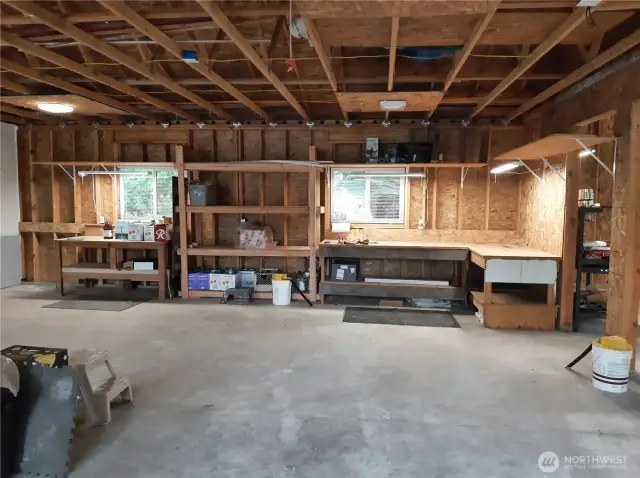Expansive 3-bay garage provides versatility for cars, tools, and creative pursuits.