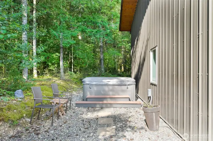 Hot tub adjacent to out building