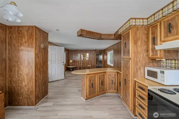 Looking from Kitchen to breakfast bar and living room area