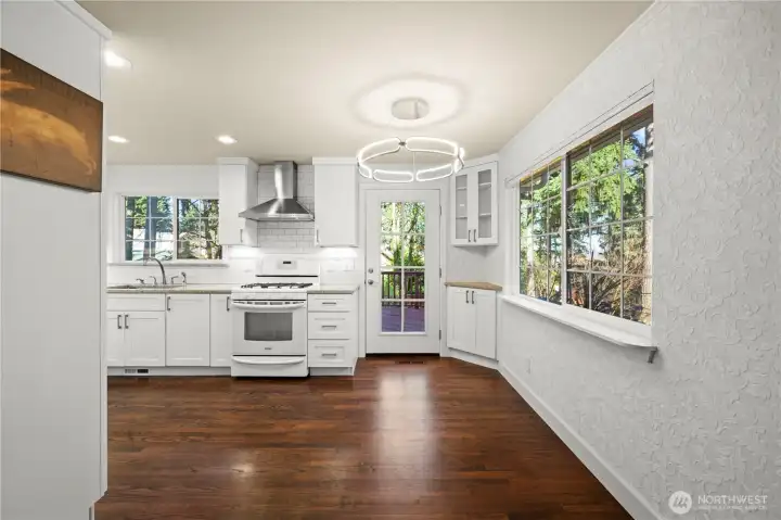 Beautifully updated kitchen & dining area, the door leads out to large deck that overlooks backyard.