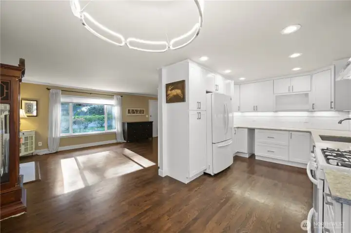 Spacious living room with refinished oak hardwoods, beautifully updated kitchen & dining area.