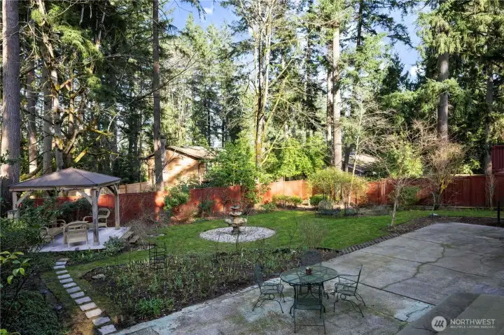 Beautiful, very private backyard with gazebo, oversized patio & established landscaping