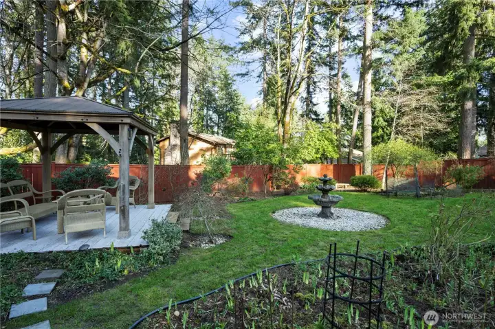 Beautiful, very private backyard with gazebo, oversized patio & established landscaping