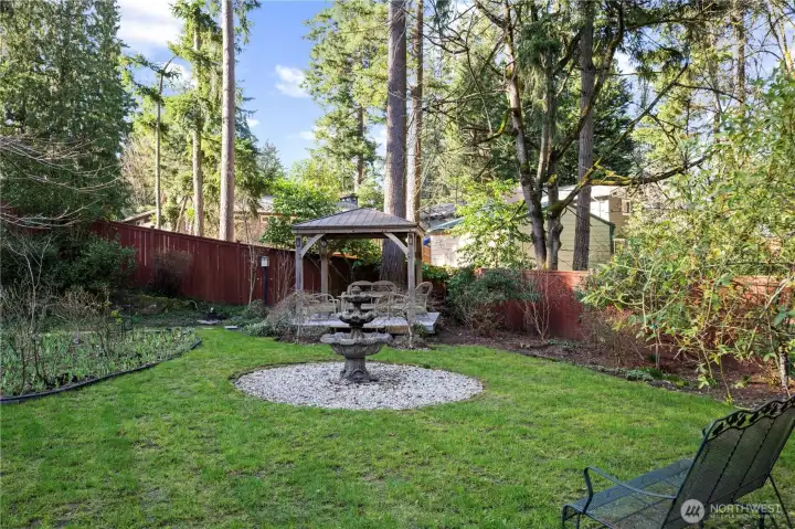Beautiful, very private backyard with gazebo, oversized patio & established landscaping