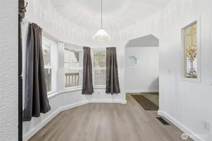 Breakfast nook off kitchen. Entry beyond